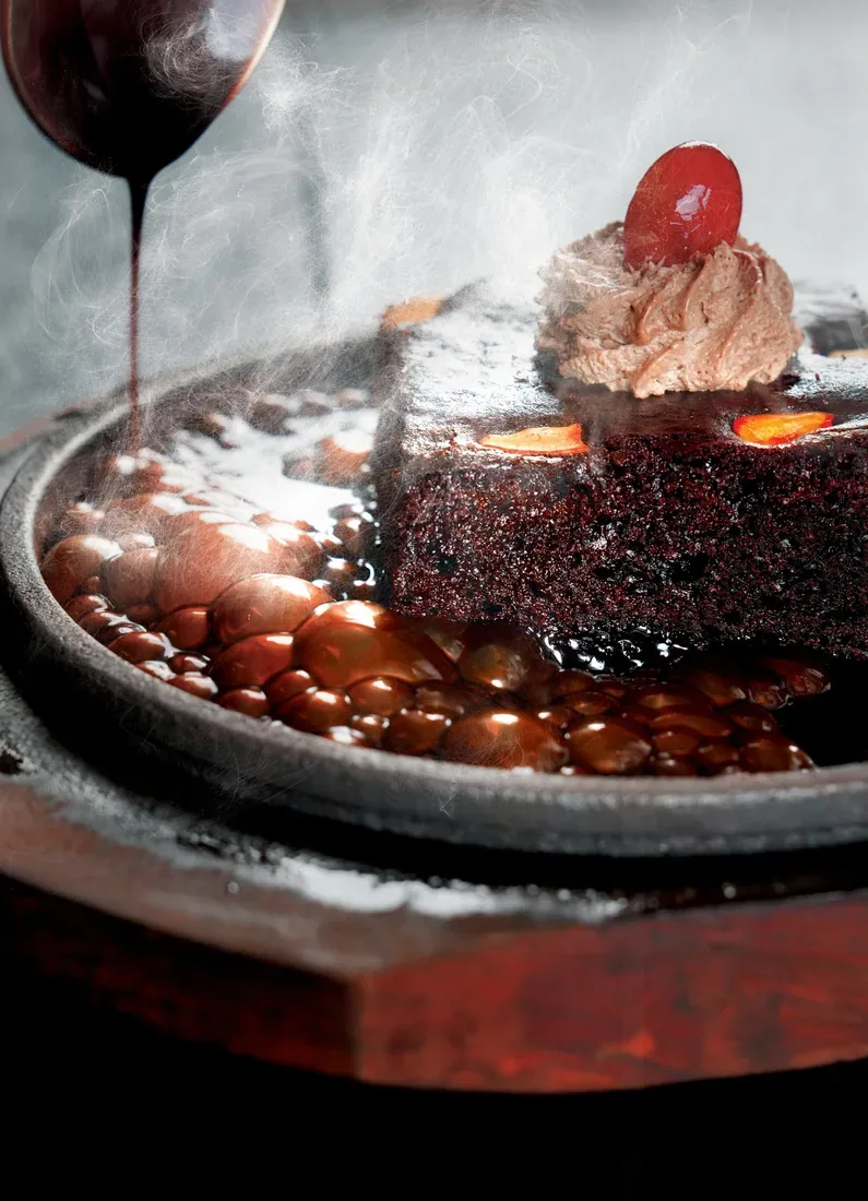 Sizzling chocolate brownie with hot chocolate sauce and steam — food photographer in Dubai