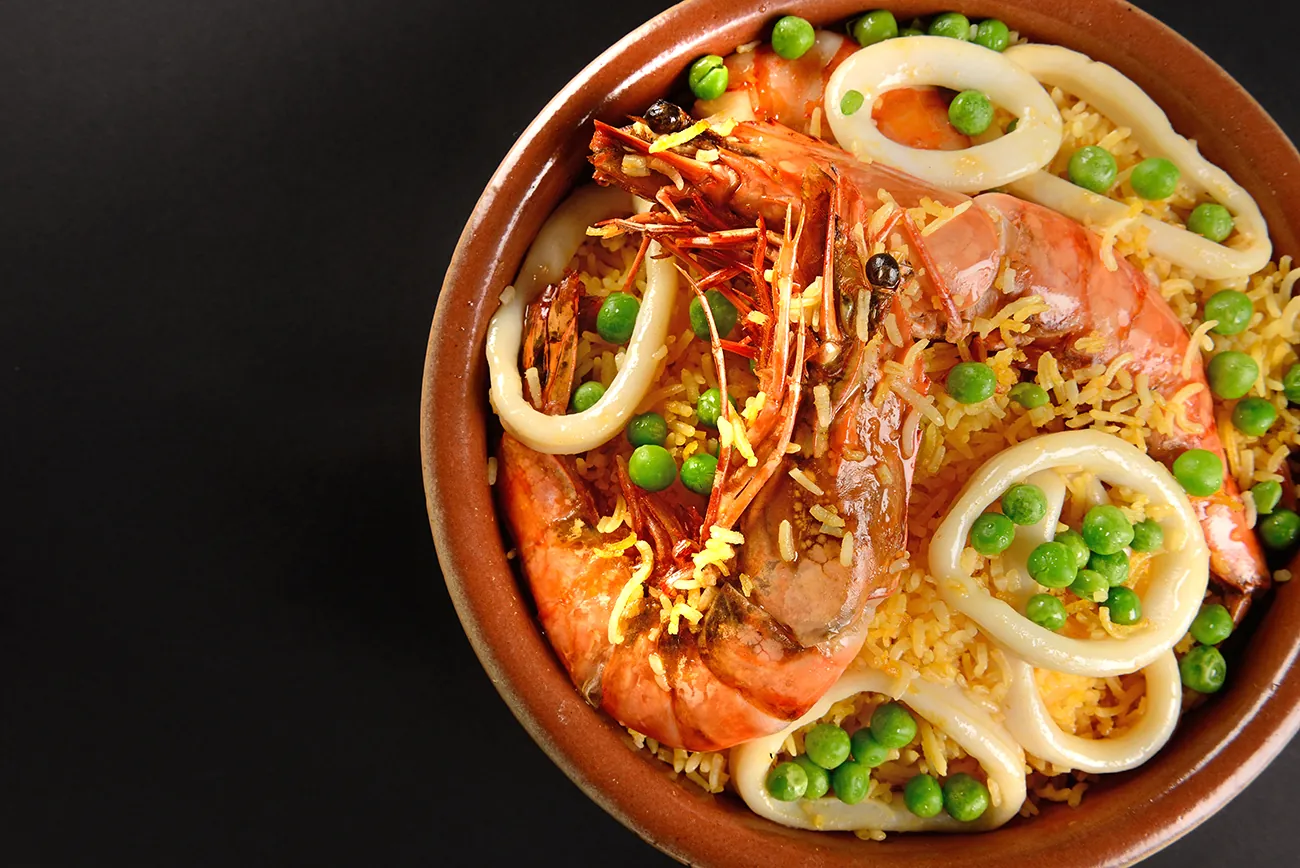 Saffron seafood rice with tiger prawns, food photography Doha Qatar