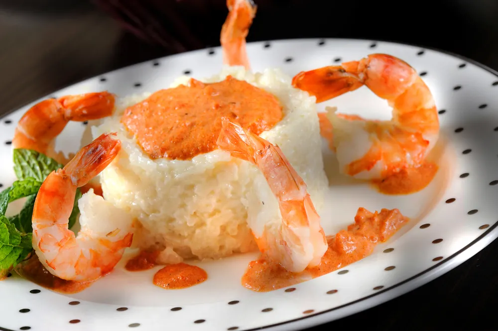 Grilled tiger prawns with rice and bisque, hotel food photography Doha