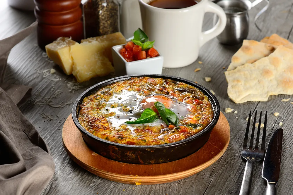 Shakshuka breakfast skillet, hotel breakfast photography Qatar