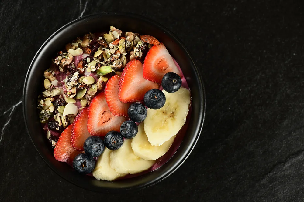 Acai bowl with fresh fruit, café menu photography Doha Qatar