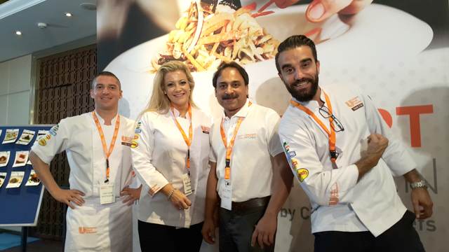 Attendees engaging with the Smart Kitchen display